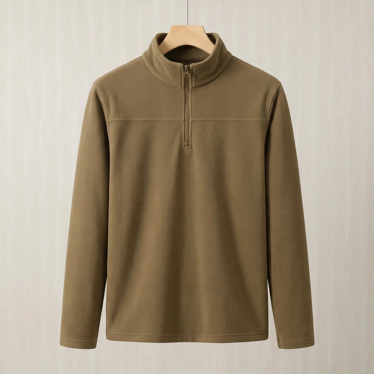 Yellow brown brushed fleece half zip pullover on a wooden hanger, front view