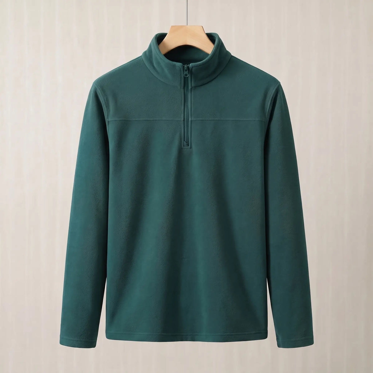 Wood green brushed fleece half zip pullover on a wooden hanger, front view