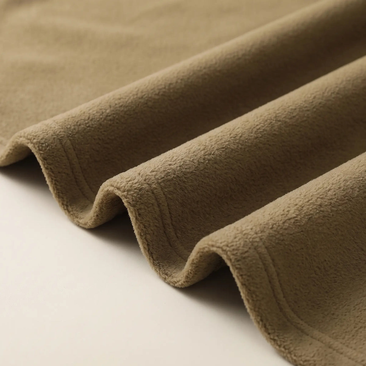 Macro close up of the soft brushed fleece fabric in yellow brown