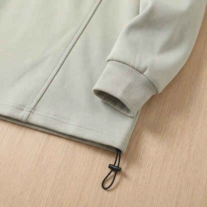 Close up of the sweatshirt hem drawcord toggle and ribbed cuff