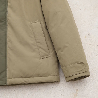 Close up of the parka hem, welt pocket and cuff