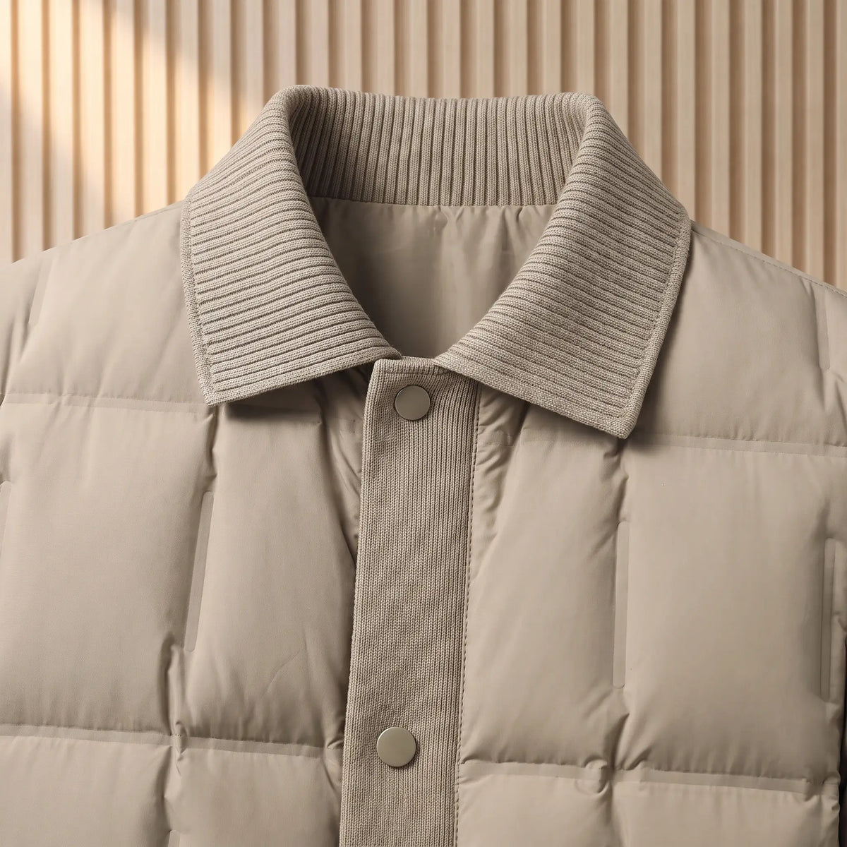 Close up of the ribbed knit collar, front placket and top snap