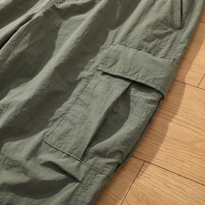 Close up of the thigh flap cargo pocket and crinkled nylon fabric