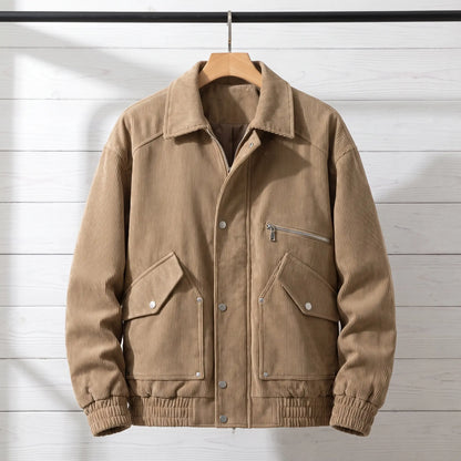 Tan coffee corduroy bomber jacket with snap front placket on a wooden hanger, front view