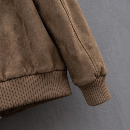 Close up of the ribbed hem band and ribbed cuff on the suede jacket