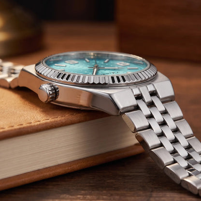 Honeycomb dial watch crown and steel bracelet detail