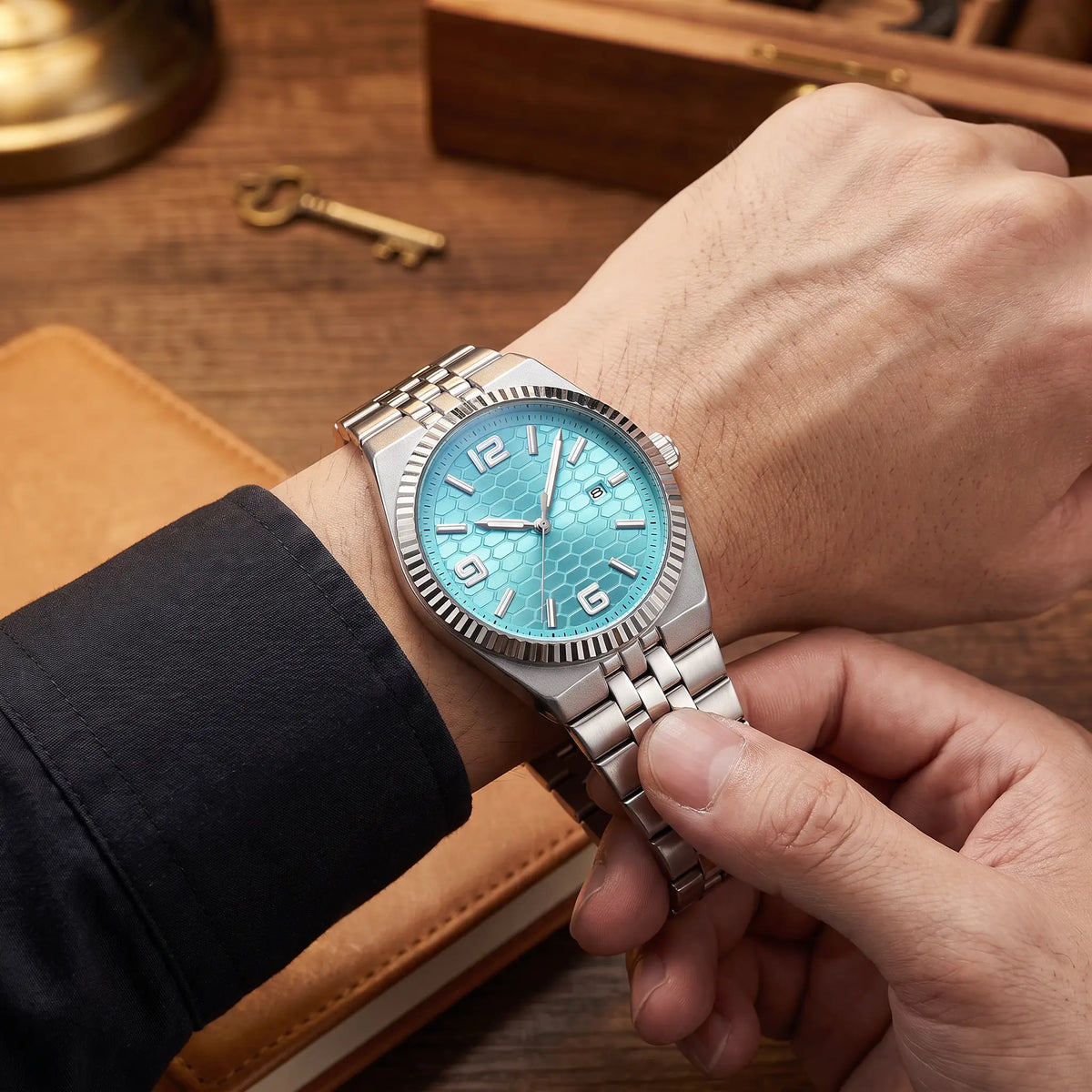 Honeycomb dial watch being clasped on the wrist