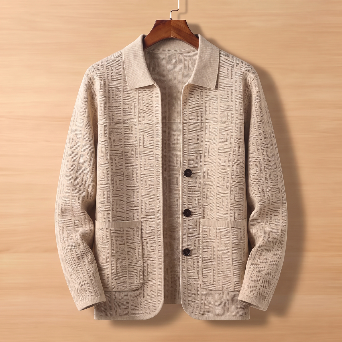 Beige jacquard knit cardigan on wooden hanger