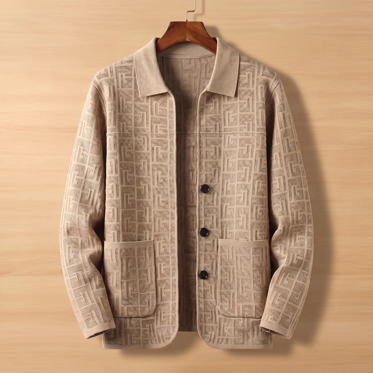 Beige jacquard knit cardigan on wooden hanger