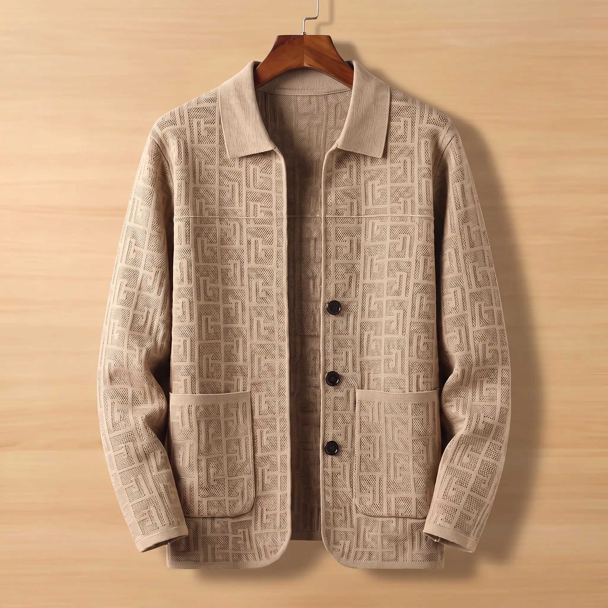 Beige jacquard knit cardigan on wooden hanger