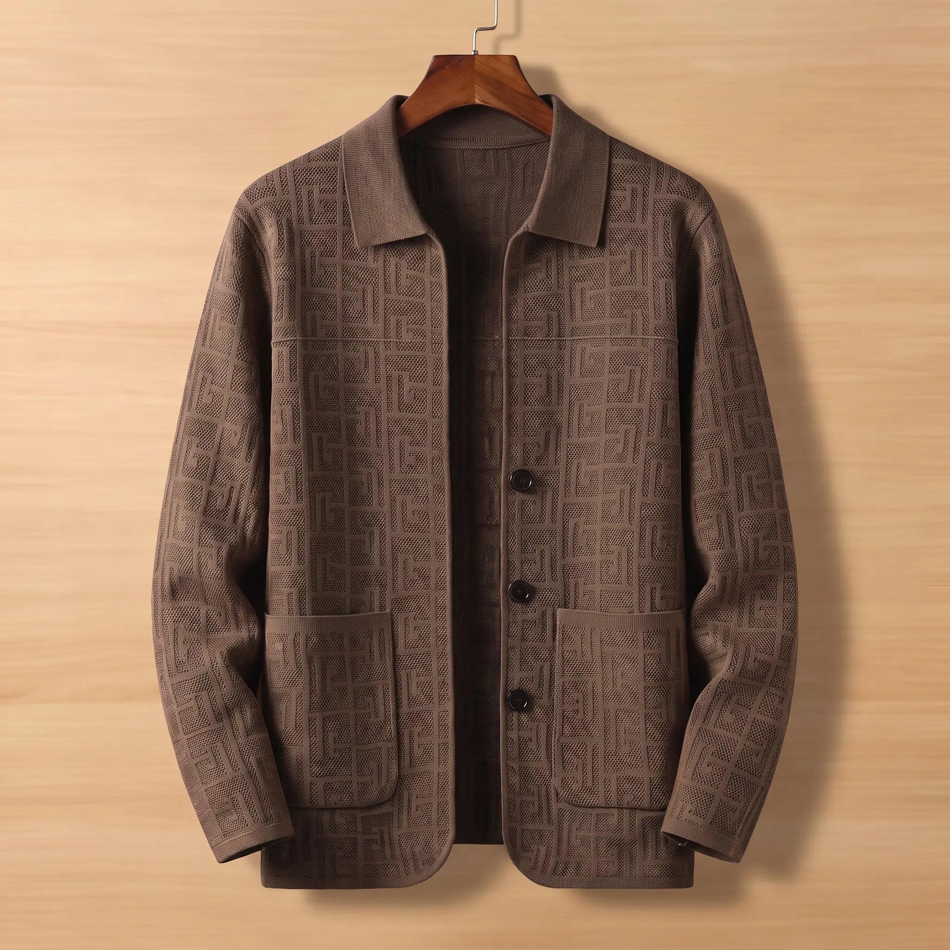 Brown jacquard knit cardigan on wooden hanger