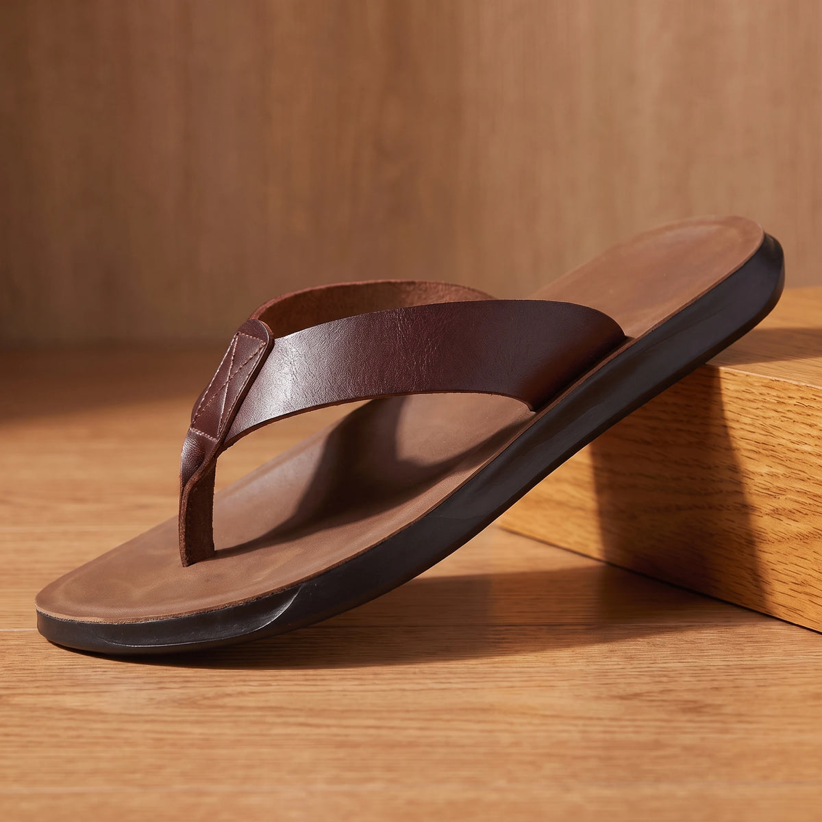 Dark brown leather thong sandal, pedestal hero