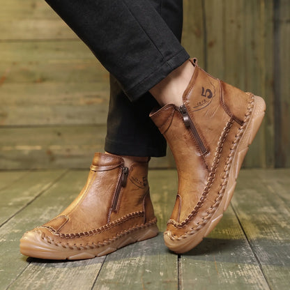 Man wearing Moccasin Seam Boots with dark trousers on a warm wood floor