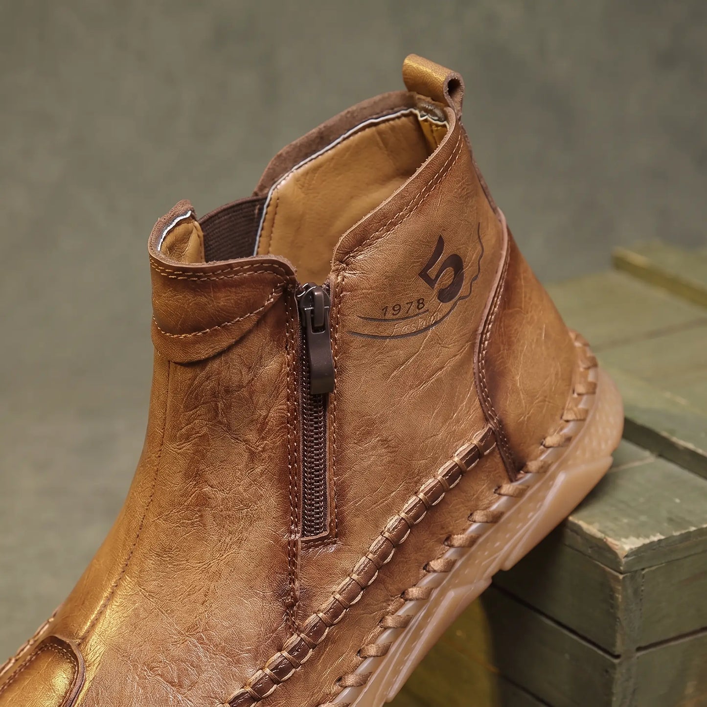 Close up of the side zip, stretch gore panel and padded collar on Moccasin Seam Boots