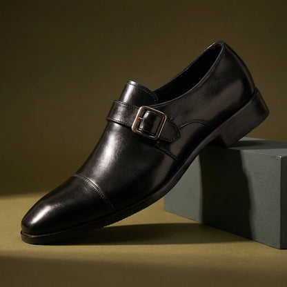 Monk Gloss Finish Shoes in black with a silver buckle strap