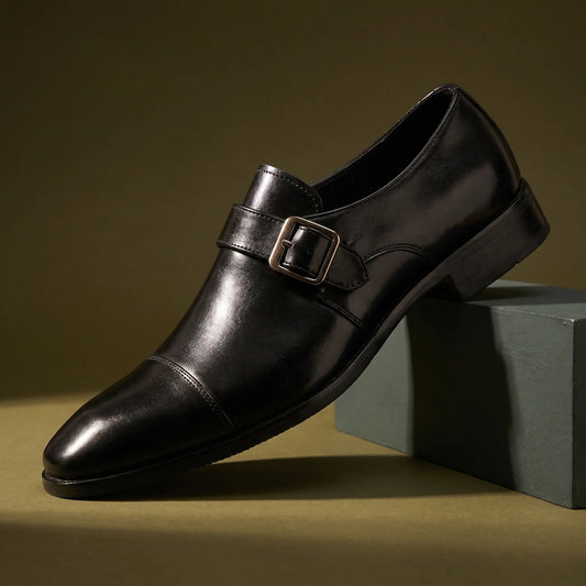 Monk Gloss Finish Shoes in black with a silver buckle strap