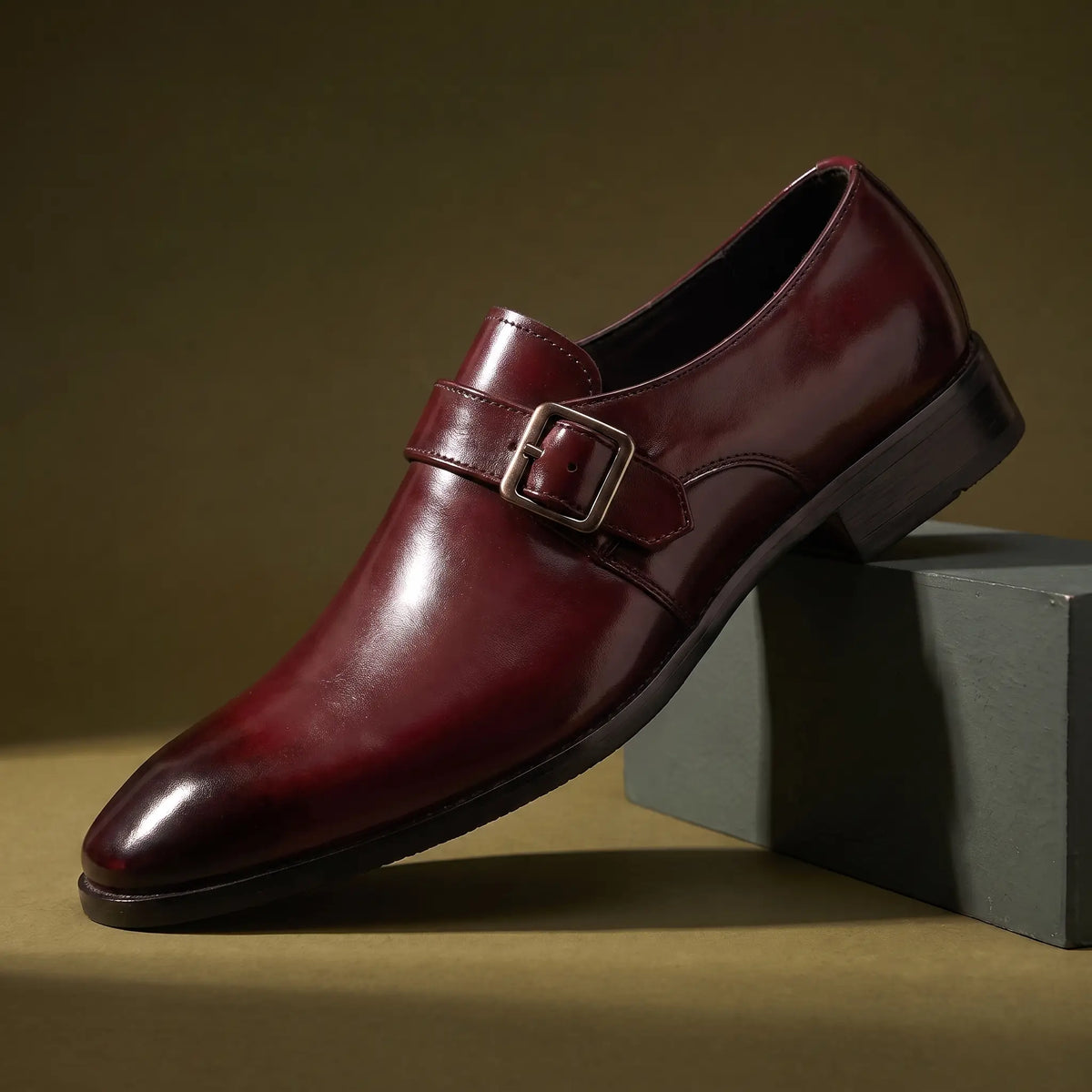 Monk Gloss Finish Shoes in wine red with a silver buckle strap