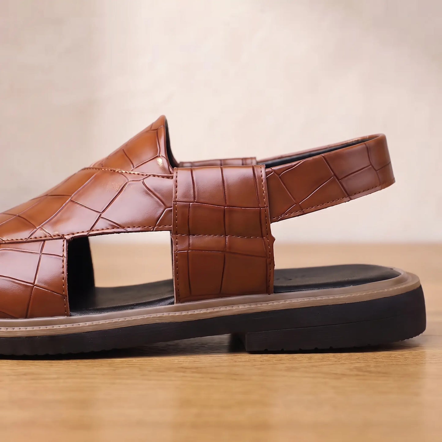 Close up of the side cut out, slingback heel strap and stacked sole on the brown Open Back Sandals