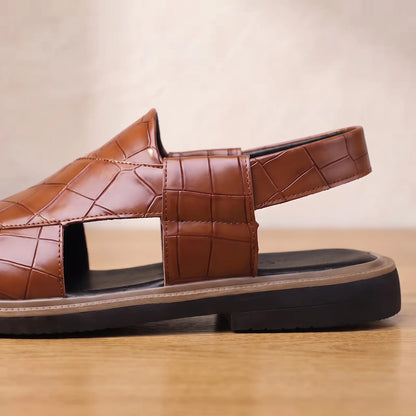Close up of the side cut out, slingback heel strap and stacked sole on the brown Open Back Sandals