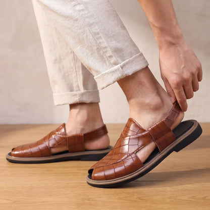 Man stepping into the brown Open Back Sandals with rolled linen trousers