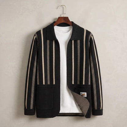Open Front Cardigan in black with beige stripes, a vertically striped knit cardigan with a turn down collar and two patch pockets on a wooden hanger