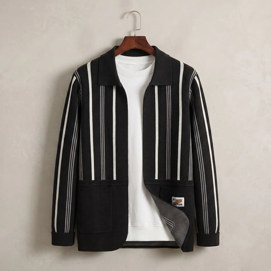 Open Front Cardigan in black with white stripes, a vertically striped knit cardigan with a turn down collar and two patch pockets on a wooden hanger