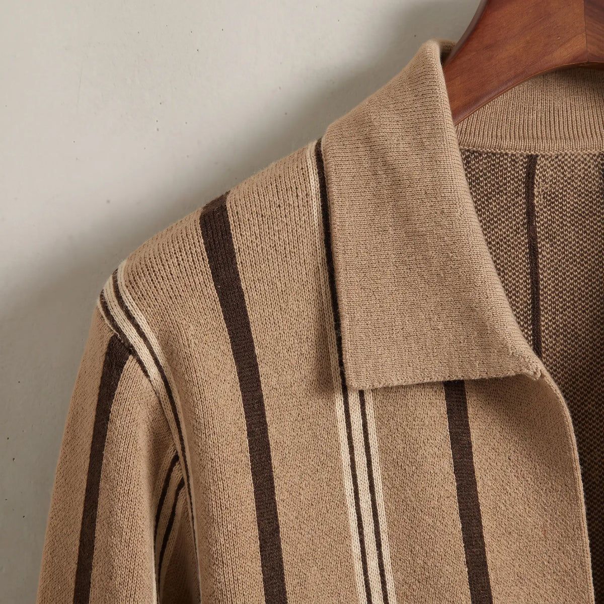Close up of the flat turn down knit collar and vertical stripes on the khaki Open Front Cardigan