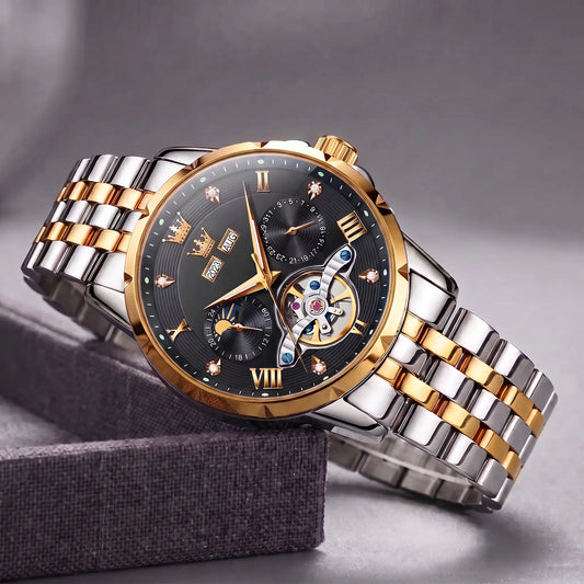 Open Heart Watch with gold bezel, black dial, moon phase and exposed gear window, on a two tone steel band