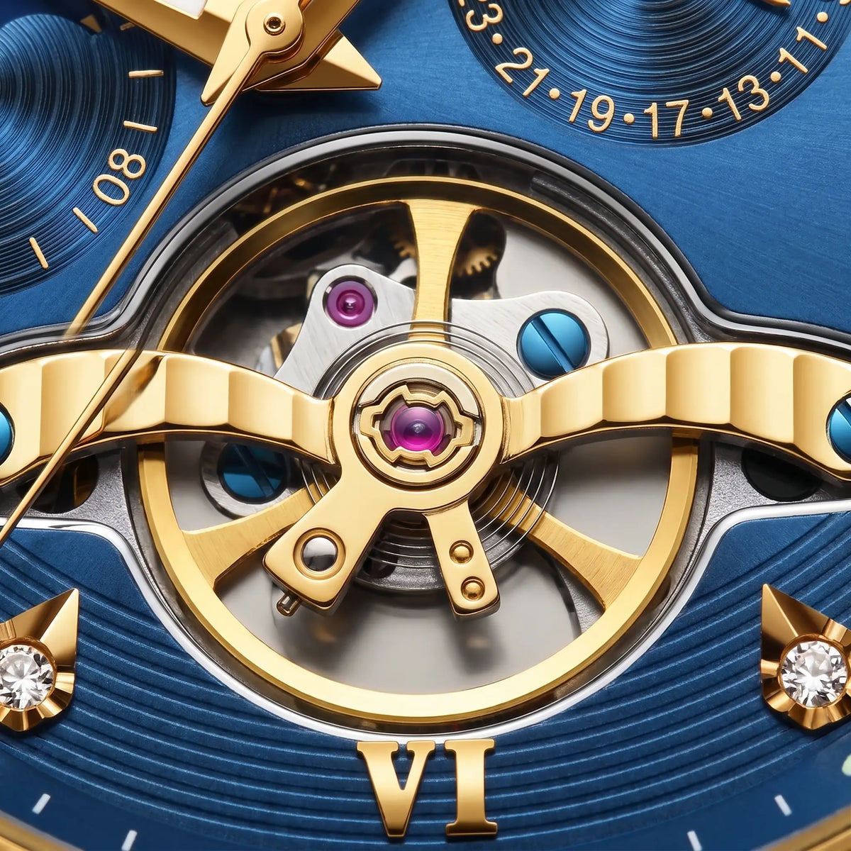 Close up of the open heart window on the Open Heart Watch showing the gold bridge, turning gears and coloured jewels