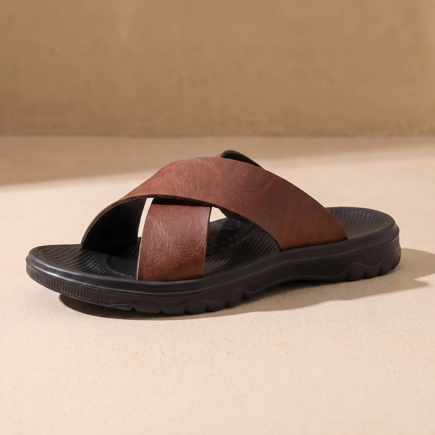 Red brown men's cross-strap slide sandal on sandy floor
