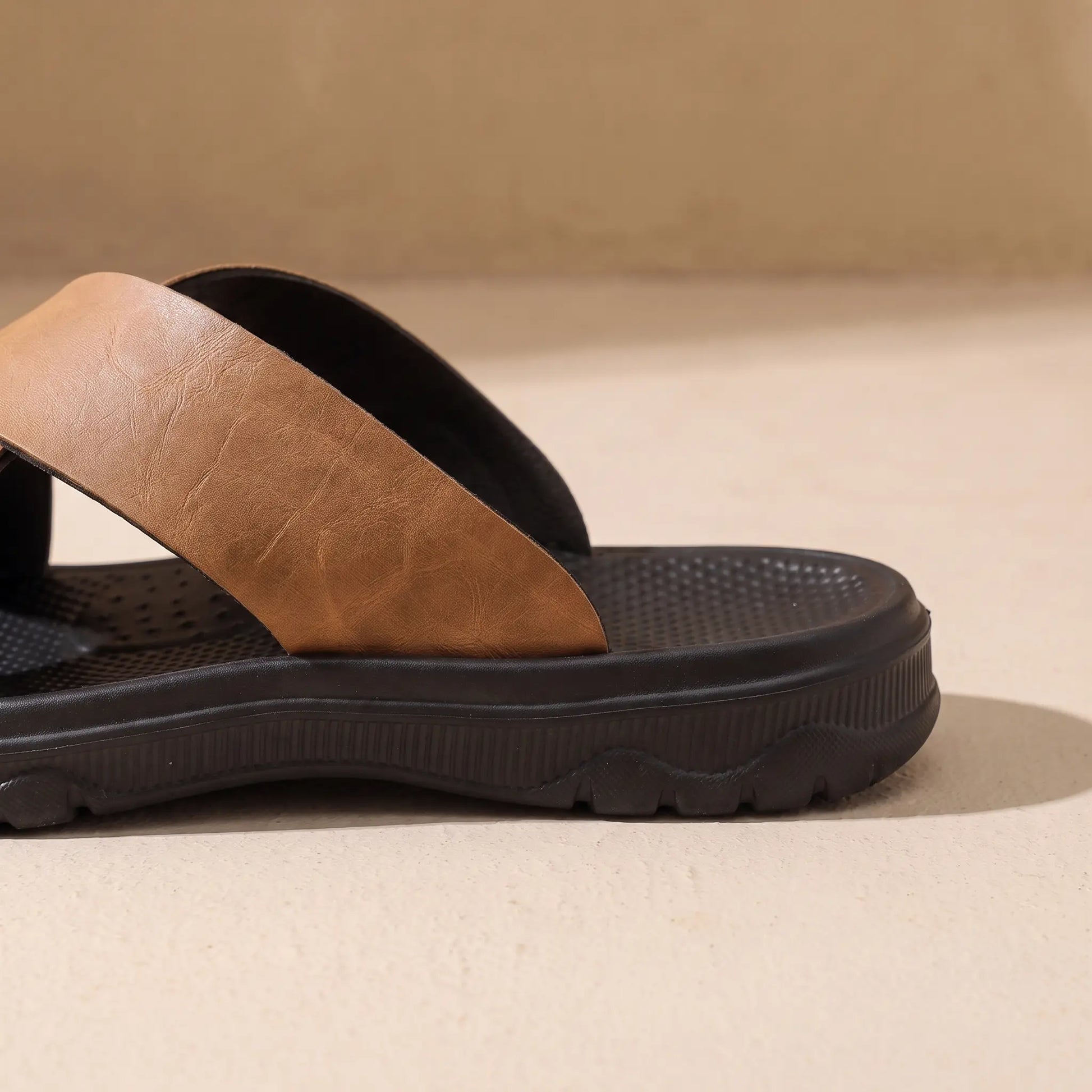Cross-strap slide heel and sole detail