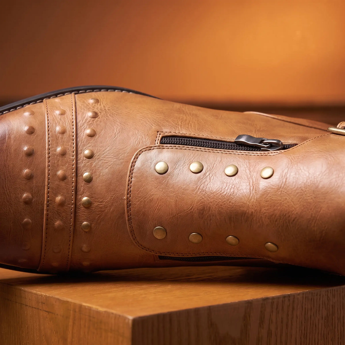 Close up of the metal stud rows and vamp zip on the Pointed Brogue Boots