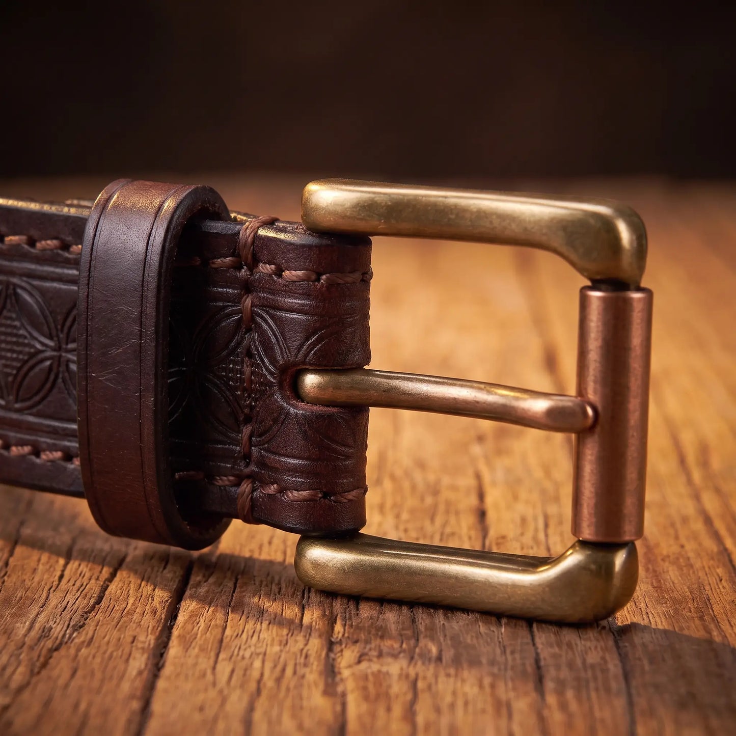 Close up of the antique brass prong buckle and leather keeper loop on the Pressed Pattern Belt