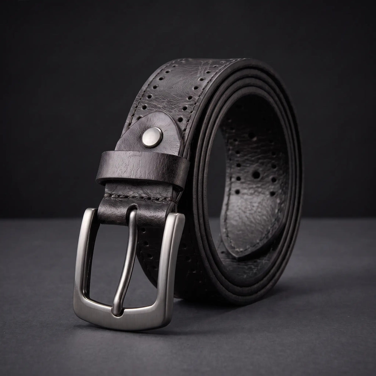 Punched Hole Belt in black with rows of punched holes, rivet stud and gunmetal buckle