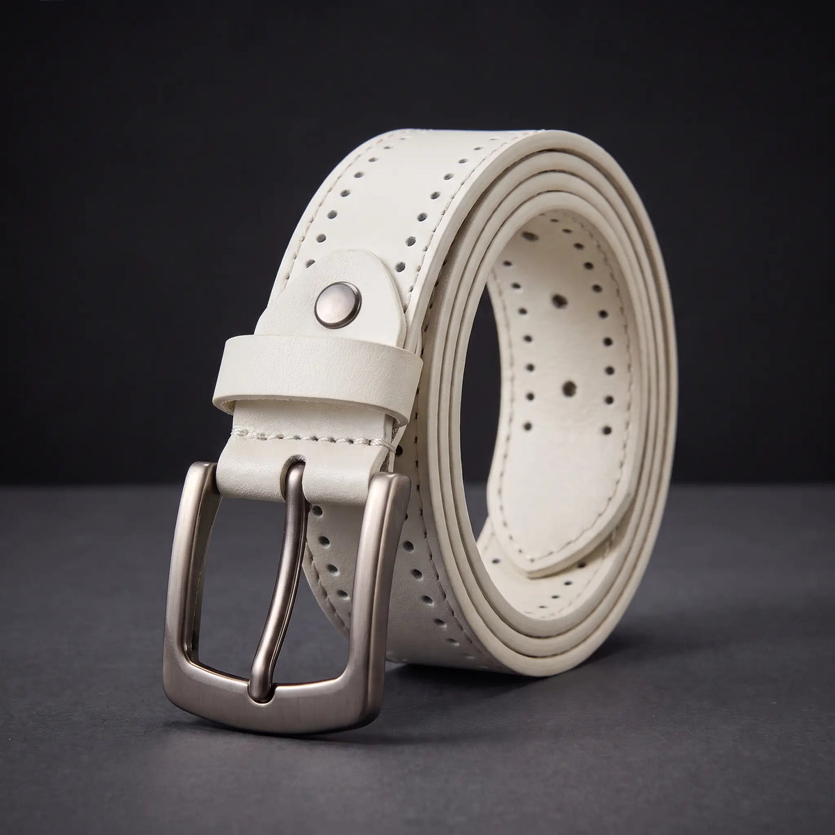 Punched Hole Belt in white with rows of punched holes, rivet stud and gunmetal buckle