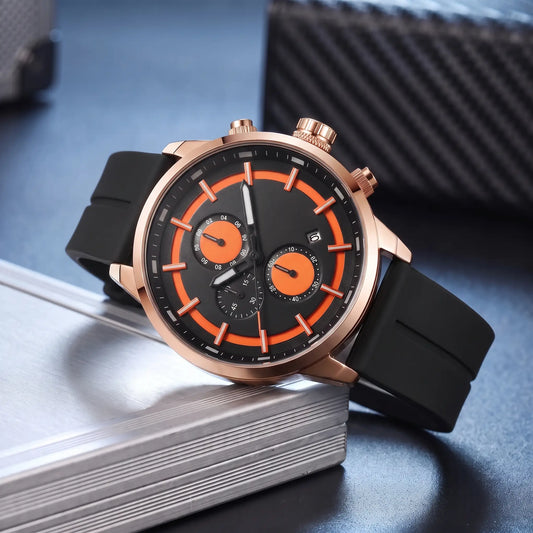 Raised Marker Watch with rose gold case, black dial with orange accents and black rubber strap