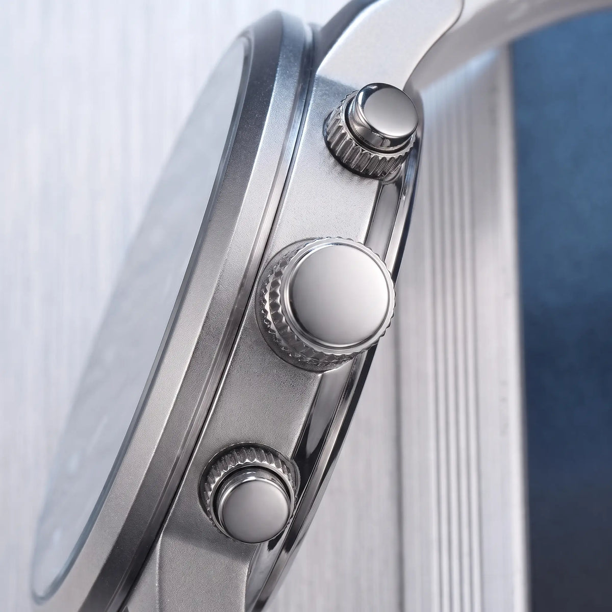 Close up of the ridged crown and two timing buttons on the side of the Raised Marker Watch