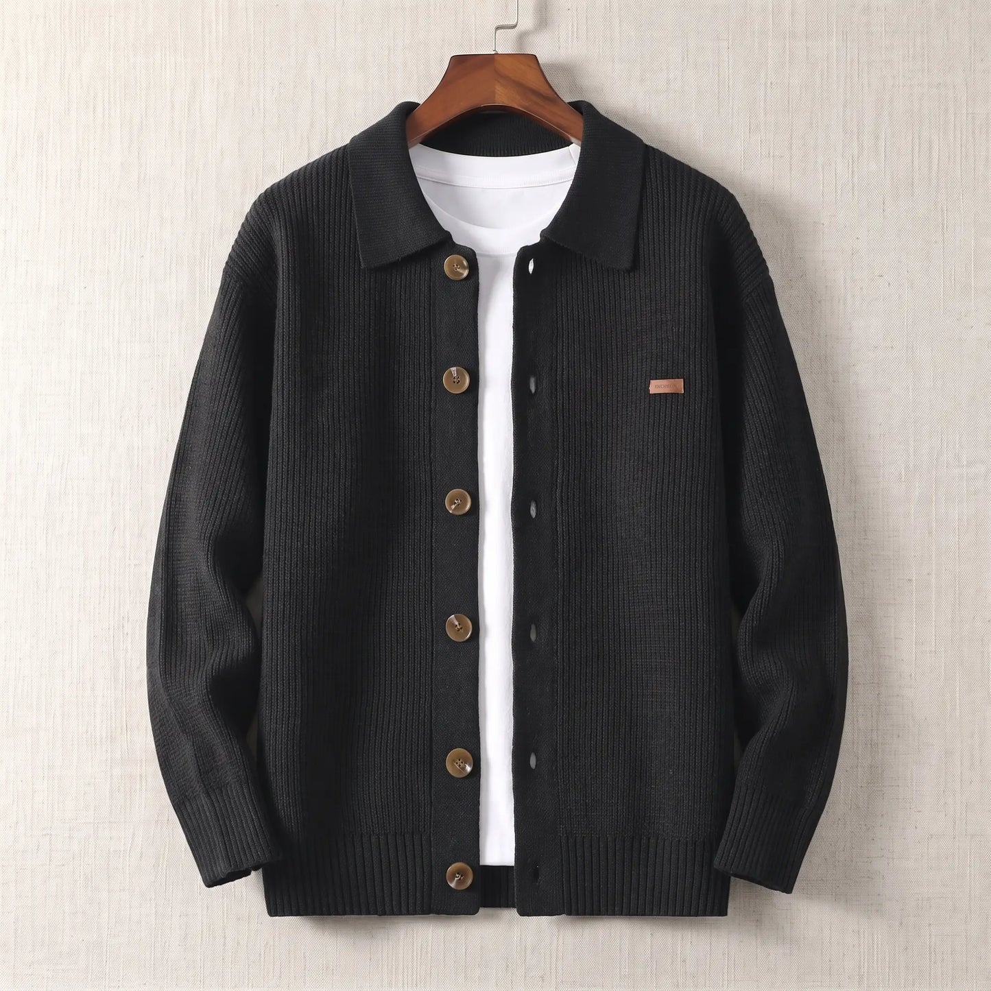 Rib Texture Jacket in black, a ribbed knit button front cardigan jacket with a turn down collar on a wooden hanger