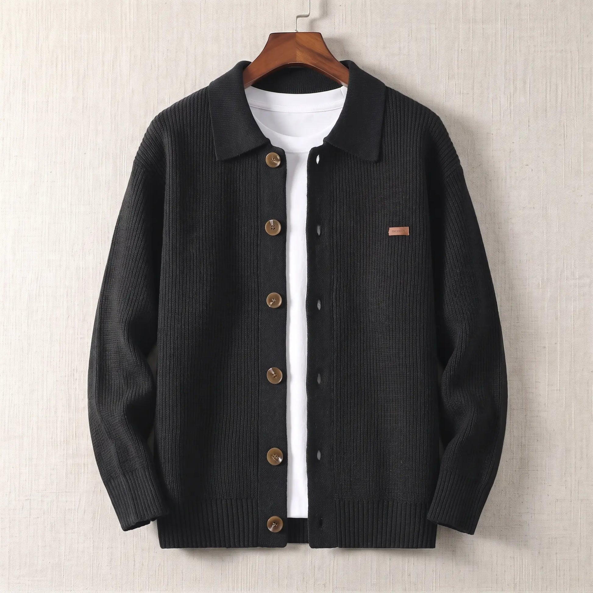Rib Texture Jacket in black, a ribbed knit button front cardigan jacket with a turn down collar on a wooden hanger