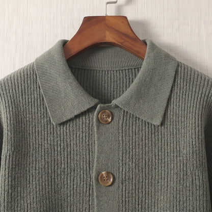 Close up of the flat turn down collar and round wood tone buttons on the green Rib Texture Jacket
