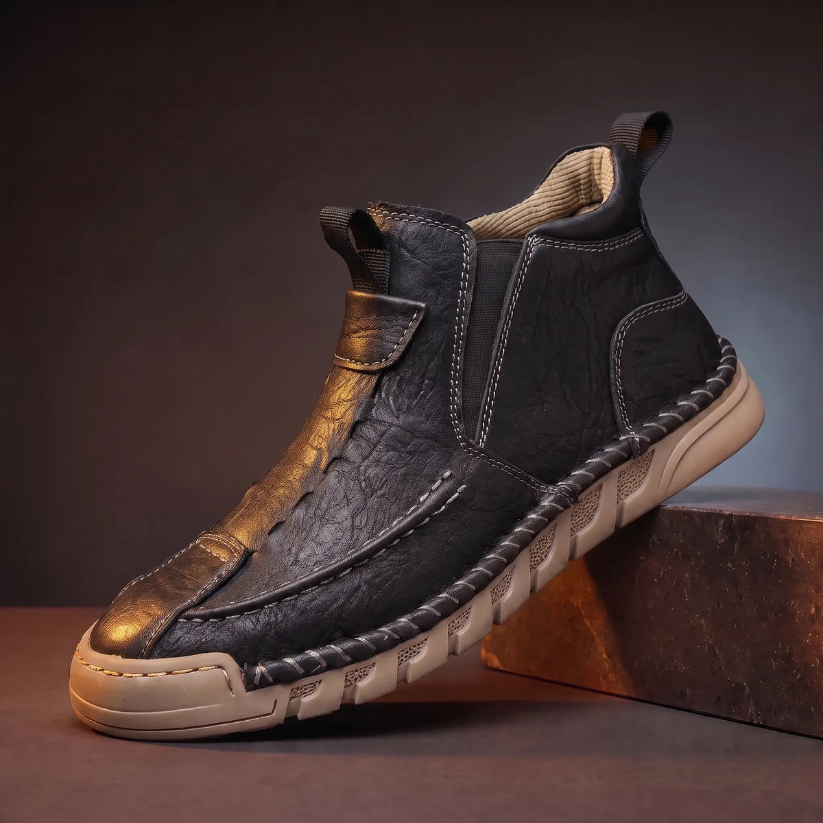 Saddle Seam Boots in black, a hand stitched slip-on leather ankle boot with a gum sole