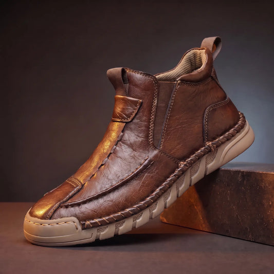 Saddle Seam Boots in brown, a hand stitched slip-on leather ankle boot with a gum sole