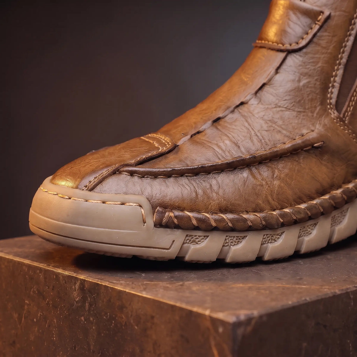 Close up of the toe, welt stitching and scalloped gum sole on the Saddle Seam Boots