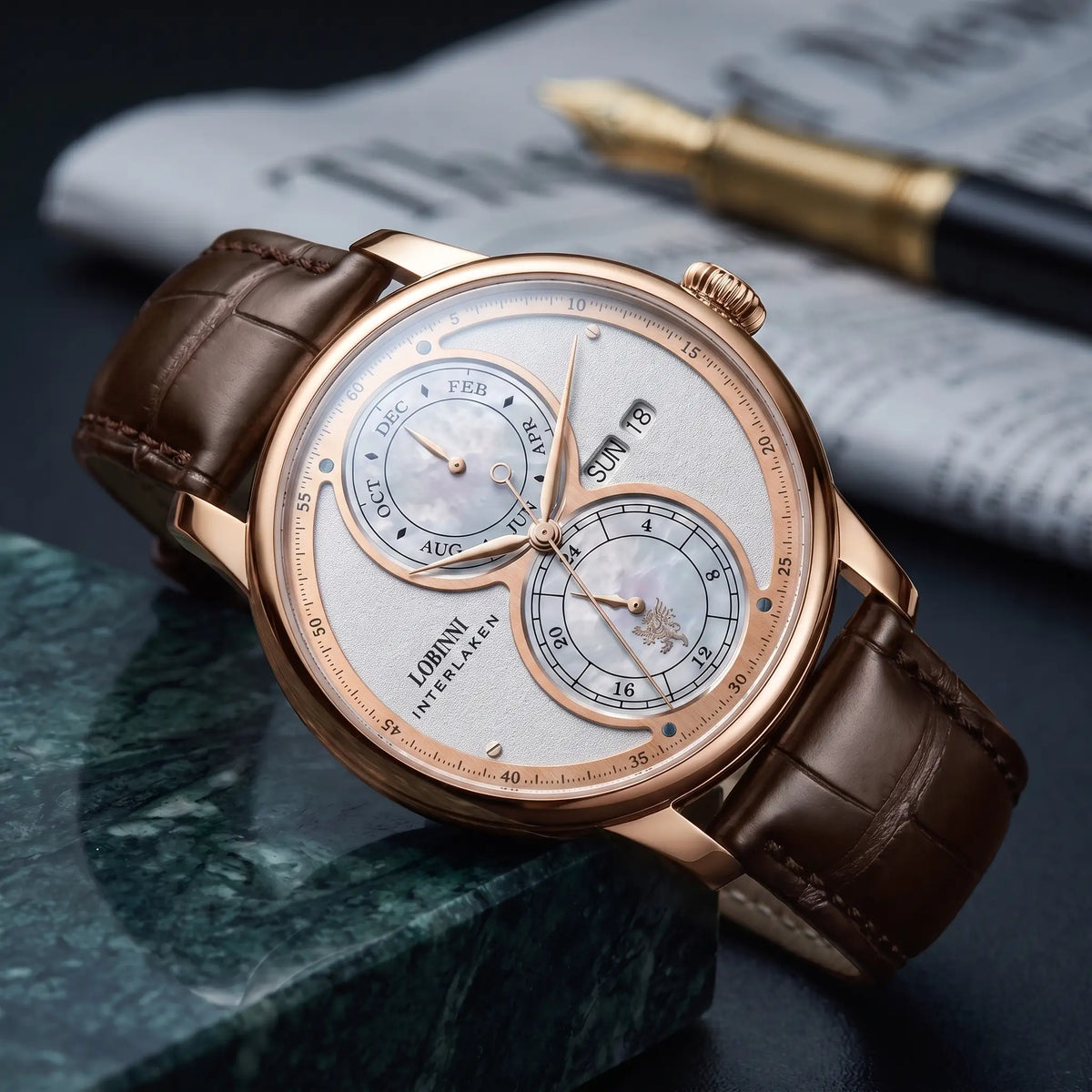 Rose gold case white split dial automatic watch on a brown leather strap