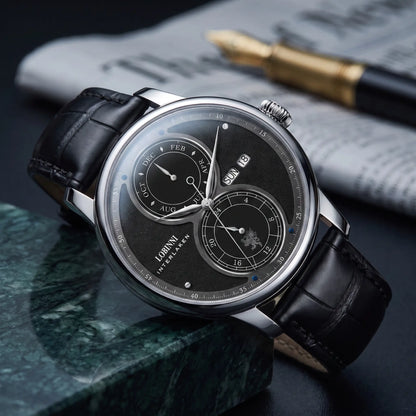Silver case black split dial automatic watch on a black leather strap