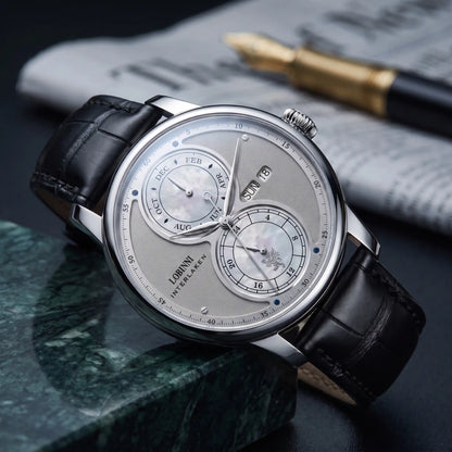 Silver case grey split dial automatic watch on a black leather strap