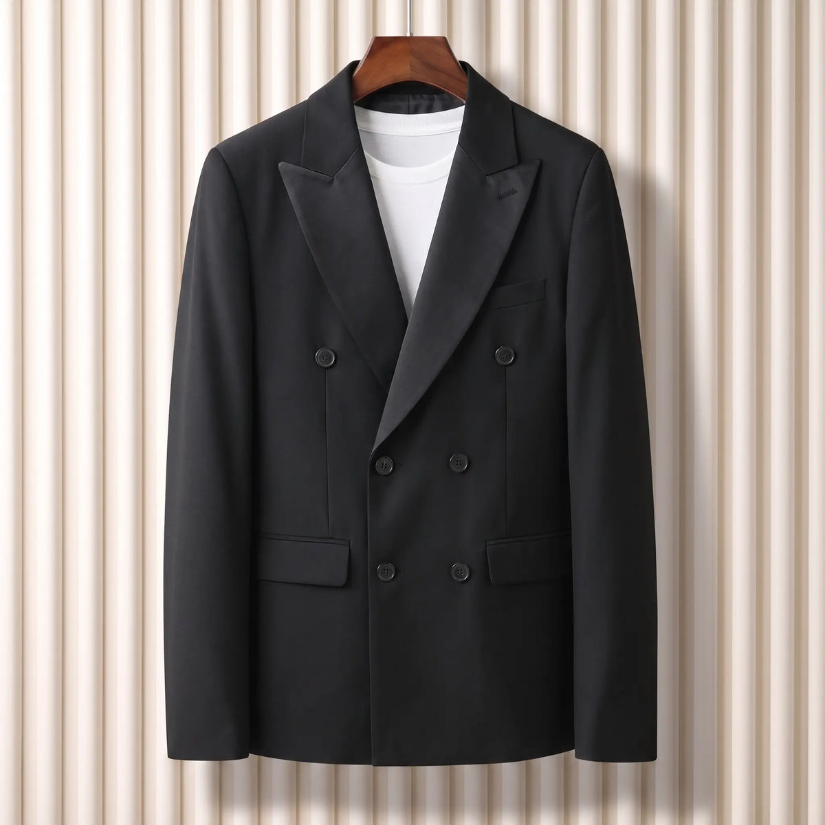 Satin Lapel Blazer in black, a slim fit double breasted blazer with a satin faced shawl lapel and flap hip pockets on a wooden hanger