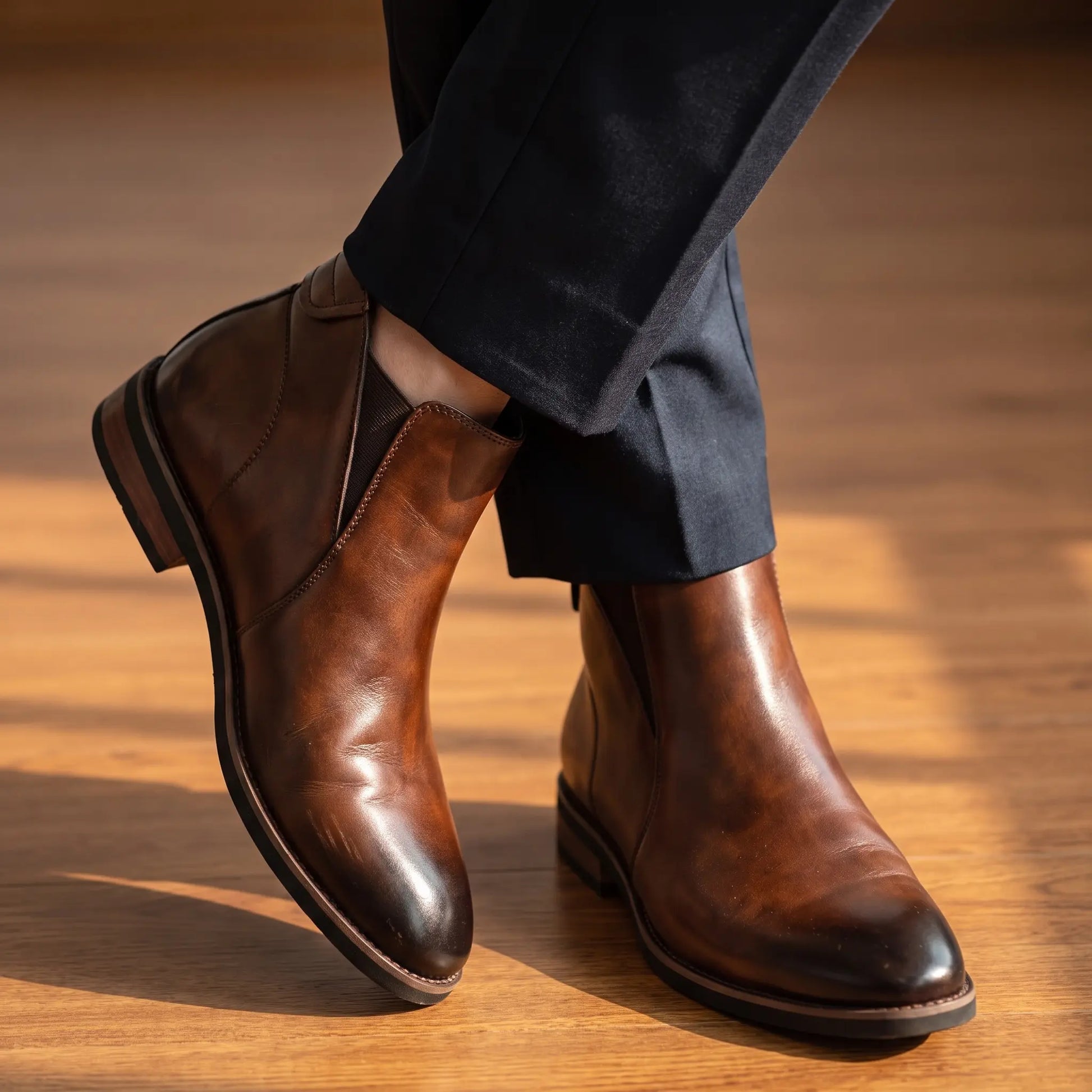 Man wearing brown Chelsea boots