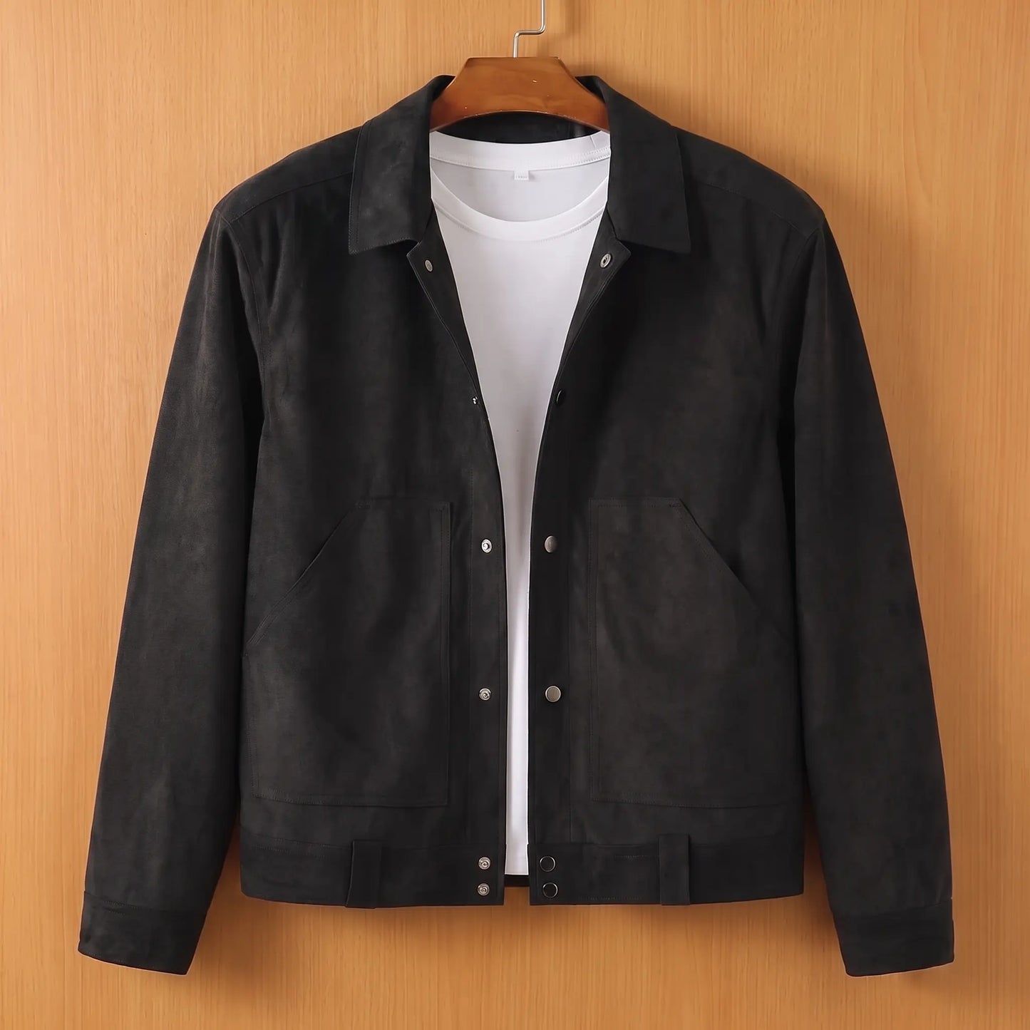Black lapel button jacket on wooden hanger