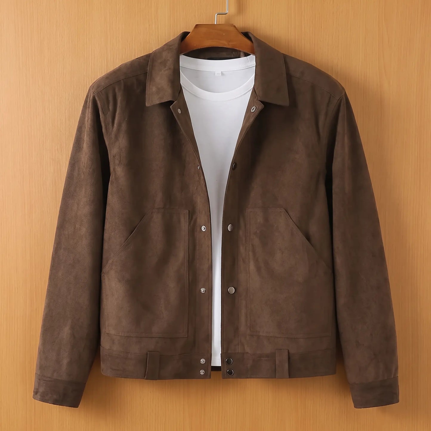 Brown lapel button jacket on wooden hanger